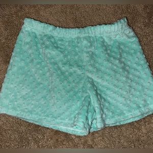 The cutest and softest pj shorts in a teal color. Never worn before. Polka dots.